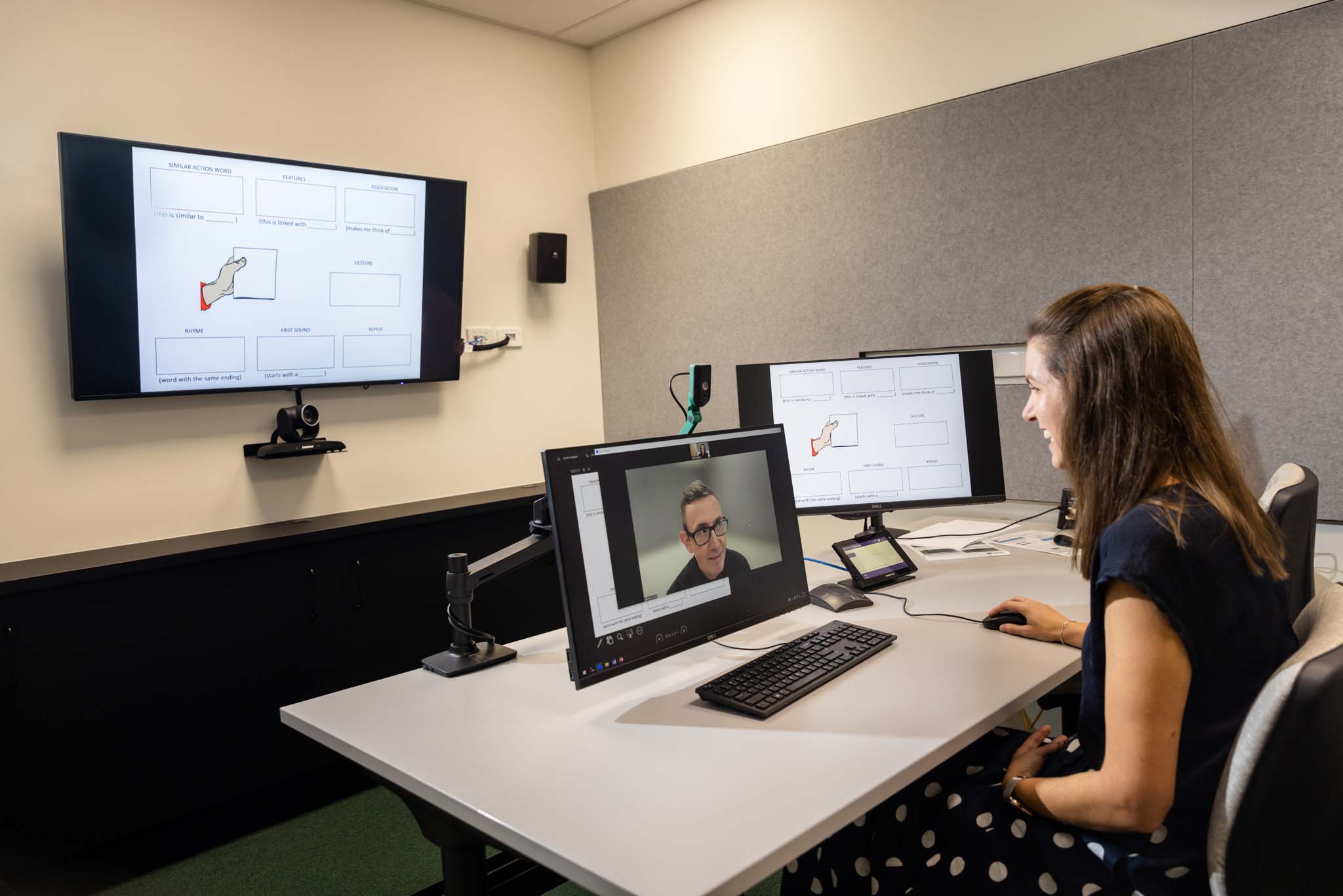 Researcher speaking with someone via telehealth