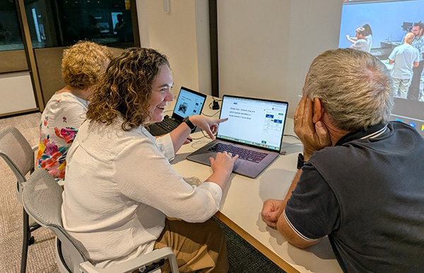 Researcher working with community members on the CommuniKey platform