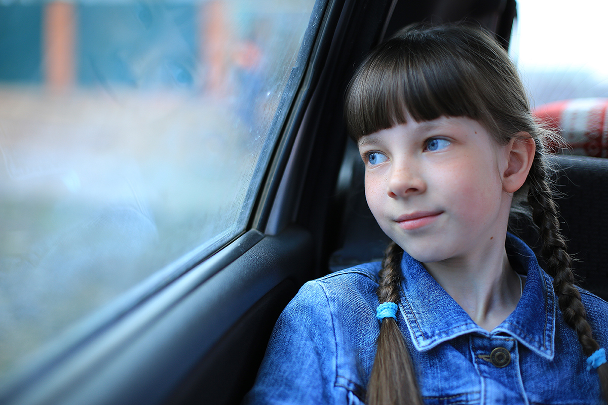 girl looking out car window