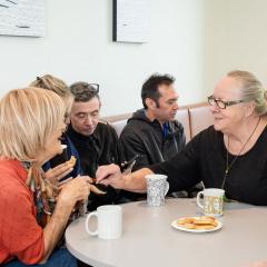  A group of people chatting around a table