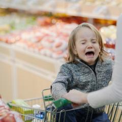 child having a tantrum in trolley 