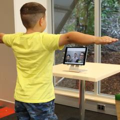 boy doing telerehabilitation